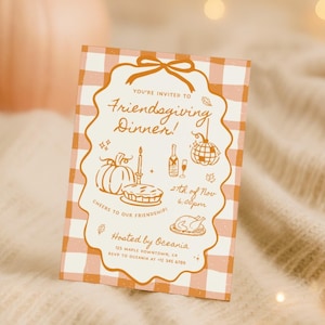 May include: A rectangular Friendsgiving dinner invitation card featuring an orange and white gingham pattern. The center includes orange line art of a pumpkin, pie, champagne, and a disco ball with text reading Friendsgiving Dinner, 2th of Nov 6:00pm, Cheers to our friendship, and Hosted by Oceania.