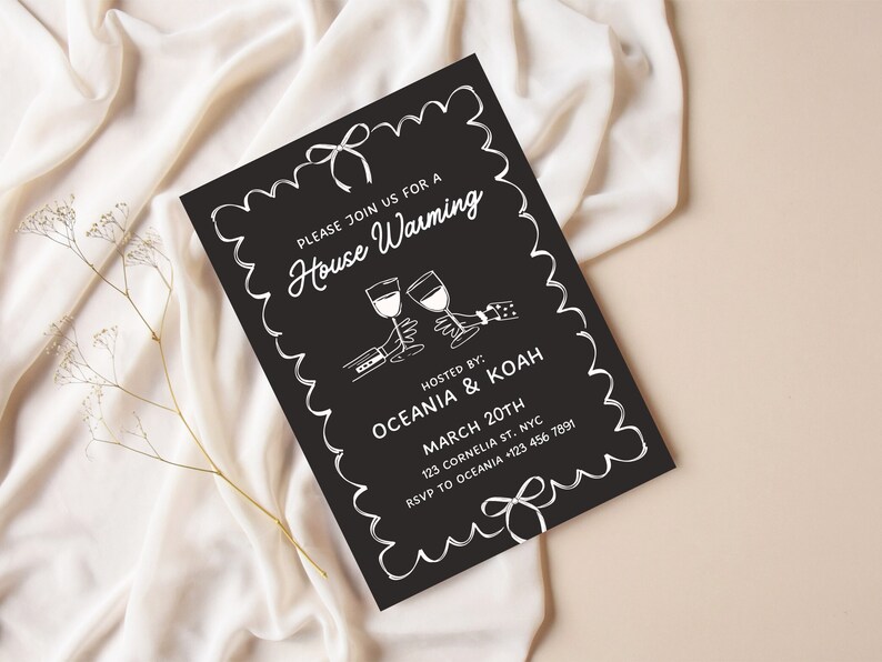 May include: Black and white housewarming invitation with a decorative border. The invitation reads "Please join us for a House Warming" and includes the names "Oceania & Koah", the date "March 20th", the address "123 Cornelia St. NYC", and the RSVP information "RSVP to Oceania +123 456 7891".