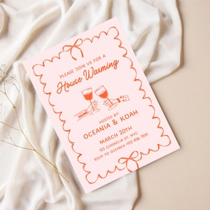 May include: A pink housewarming invitation with a red border and a red bow. The invitation says "Please join us for a House Warming" and includes the names "Oceania & Koah", the date "March 20th", the address "123 Cornelia St. NYC", and the RSVP number "+123 456 7891".
