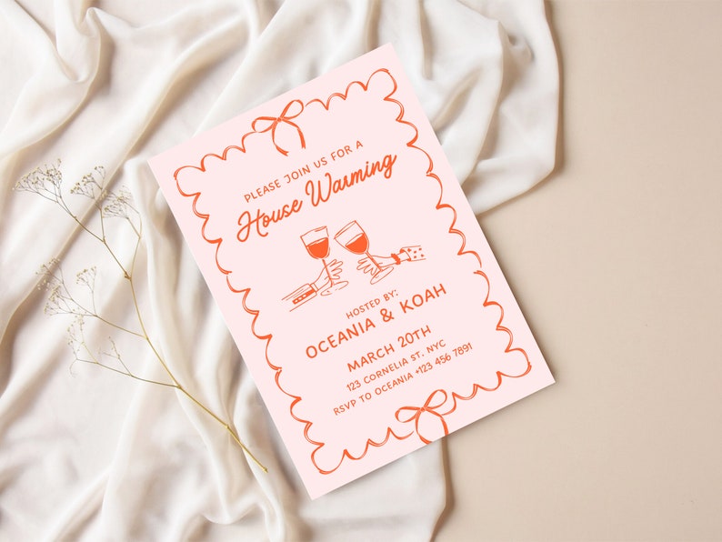 May include: A pink housewarming invitation with a red border and a red bow. The invitation says "Please join us for a House Warming" and includes the names "Oceania & Koah", the date "March 20th", the address "123 Cornelia St. NYC", and the RSVP number "+123 456 7891".