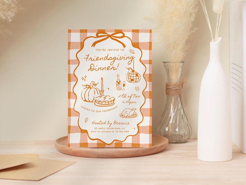 May include: A rectangular Friendsgiving dinner invitation card with an orange and white gingham pattern. The card features orange line art of a pumpkin, pie, candle, wine bottle, disco ball, and turkey with text including 21st of Nov 6:00pm.