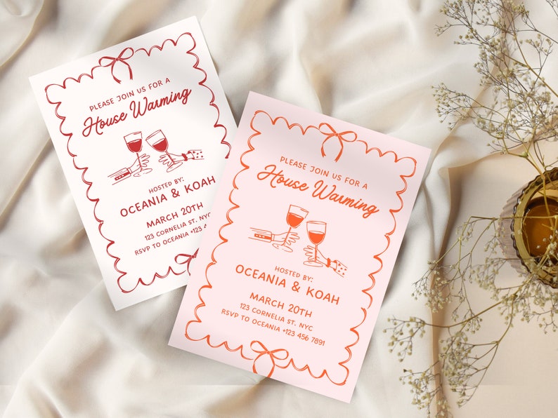May include: Two pink and white housewarming party invitations with red and white illustrations of wine glasses and a bow. The text on the invitations reads "Please join us for a House Warming" and includes the names of the hosts, the date, and the address.
