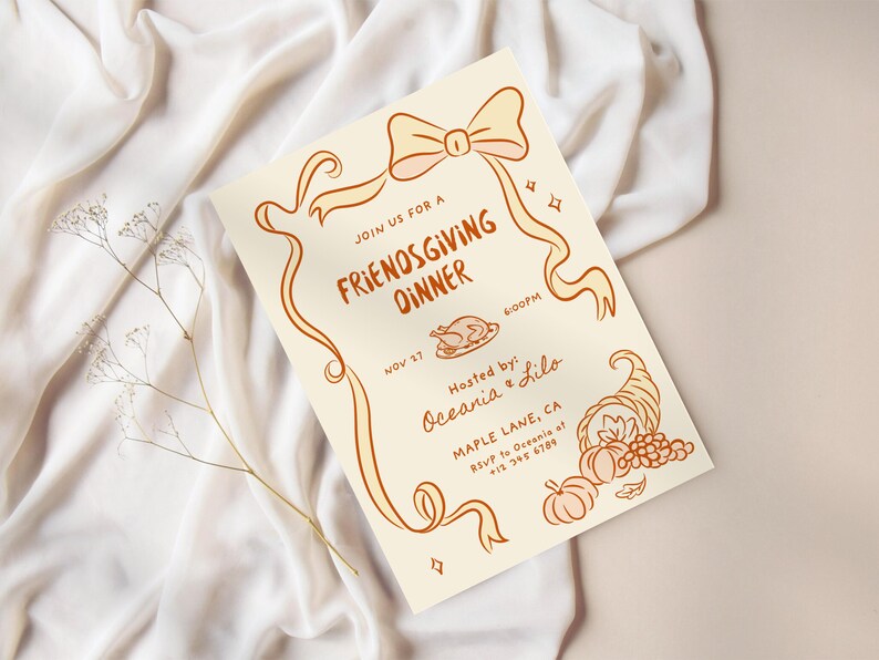 May include: A cream-colored Friendsgiving dinner invitation with orange-brown illustrations. The invitation includes text, a bow, ribbons, a turkey, and a cornucopia. The text reads "Join us for a Friendsgiving Dinner" and includes the date, time, and host's name.