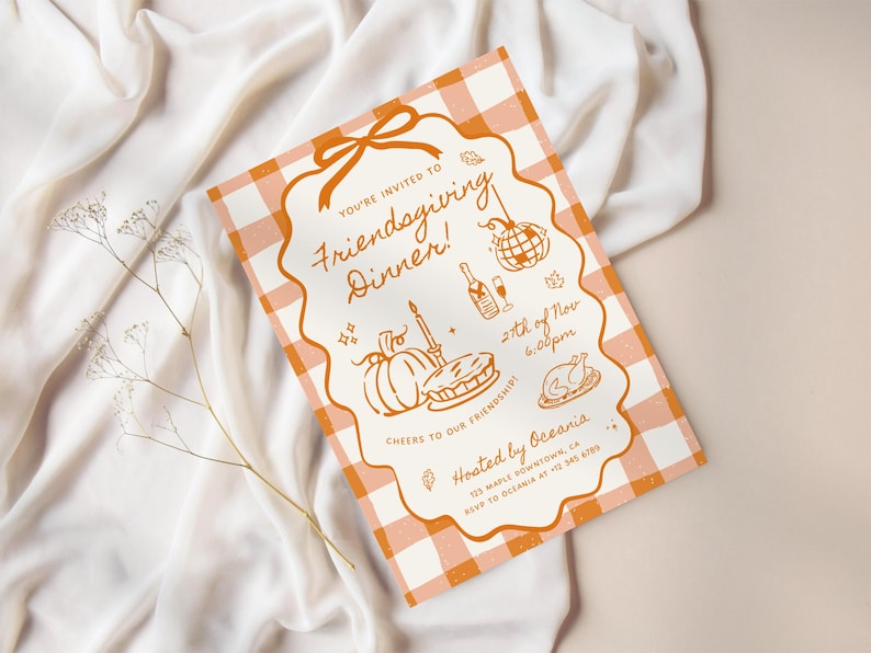 May include: A rectangular invitation card with an orange and white gingham pattern border. The center features orange line art of a pumpkin, pie, turkey, disco ball, and champagne. Text reads: You're invited to Friendsgiving Dinner! 27th of Nov 6:00pm.