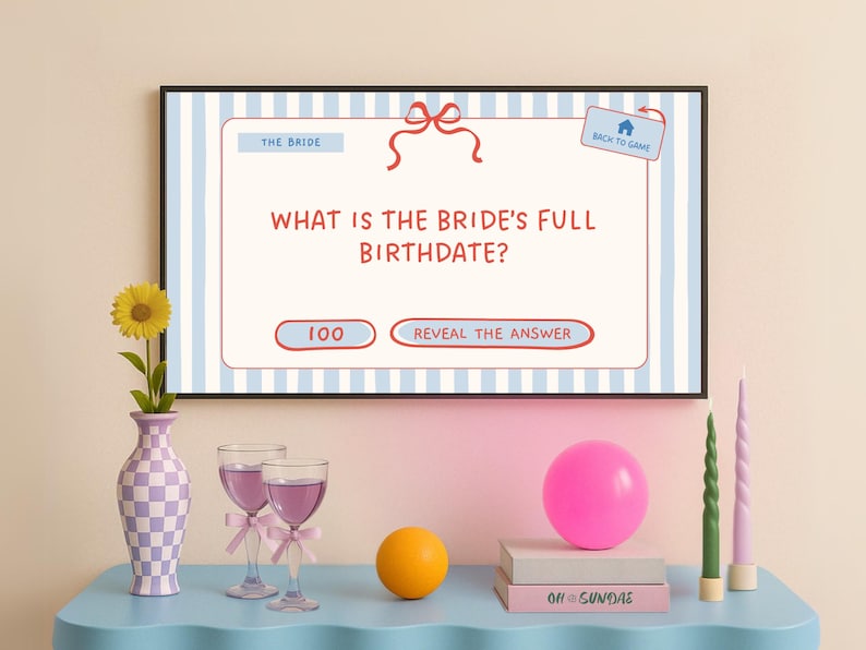 May include: A television screen displaying a game for a bridal shower. The screen shows a question asking for the bride's full birthdate. The question is followed by two buttons: "100" and "Reveal the Answer".