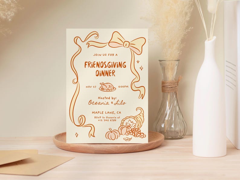 May include: A Friendsgiving dinner invitation card with a cream background and brown illustrations. The card features a bow, ribbons, a roasted turkey, pumpkins, and a cornucopia. The text reads "Join us for a Friendsgiving Dinner" and includes the date, time, and host information.
