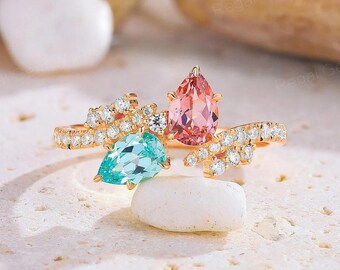 ペアカットのピンクサファイアとブルートルマリンのリング：ツートン