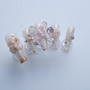 3d flower pearl butterfly, eye catching nails, golden silver gradient nails, elegant French style nails, bride wedding dress nails