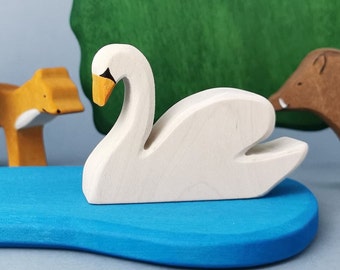 A wooden toy figurine depicting a white Swan, product for prek child, kindergarten paly toy, figurine made entirely of wood, gift for child