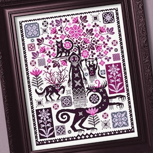 Puede incluir: Un patrón de punto de cruz en un marco oscuro que presenta una figura central etiquetada como FLATWOODS MONSTER, rodeada de criaturas estilizadas de color morado oscuro y rosa, incluyendo un gato, una bestia con cuernos y motivos florales sobre fondo blanco.