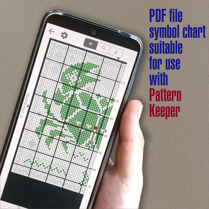 May include: A smartphone screen displaying a green and white cross-stitch pattern in the Pattern Keeper app. The screen shows a grid with numbers along the sides and a red dot marking the current position. The text "PDF file symbol chart suitable for use with Pattern Keeper" is displayed above the phone.