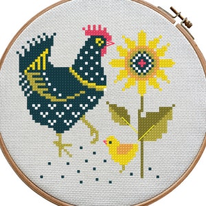 May include: Cross stitch pattern featuring a black and white chicken with a yellow beak and red comb, a yellow chick, and a yellow sunflower with green leaves.
