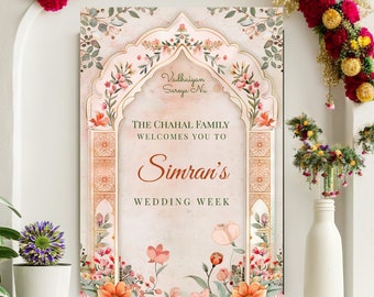 May include: A wedding announcement poster with a floral archway design. The text reads "The Chahal Family Welcomes You To Simran's Wedding Week".