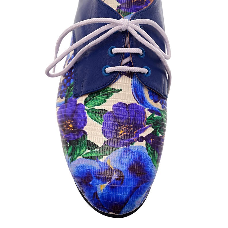 Fashionable handmade oxford shoes for women with bold blue flower pattern.