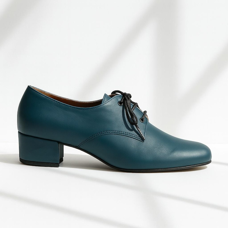 Side view of teal leather Oxfords showing genuine leather texture and elegant 3cm heel.