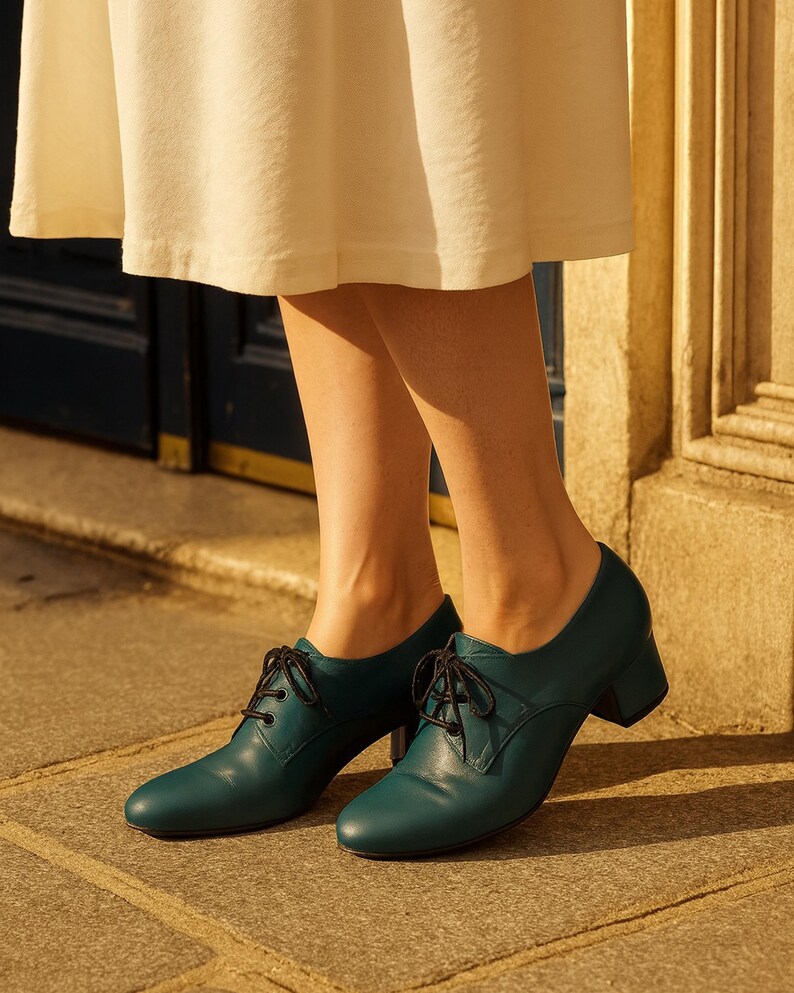 Elegant teal Oxfords with matte leather texture and classic lace-up design, handmade in Greece.