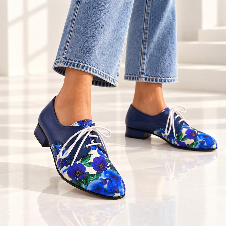 Blue floral Oxford shoes for women styled with modern light wash denim.