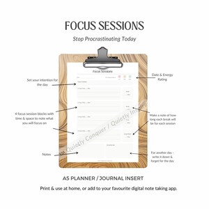 May include: A wooden clipboard holds a white A5 planner insert titled "Focus Sessions." The insert includes sections for daily intentions, focus session blocks, and energy ratings. Text on the insert reads "Stop Procrastinating Today."