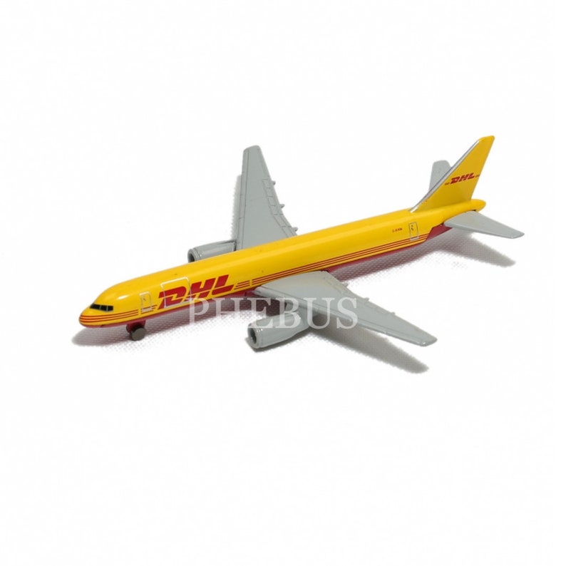 May include: A yellow and gray toy airplane with the DHL logo on the side. The model airplane has red accents and gray wings. The toy is on a white background.