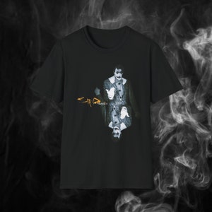 May include: Black t-shirt with a graphic of a man in a suit and a clown makeup, with the word "function" written in orange below the graphic. The word "slipknot" is written in a stylized font above the graphic.