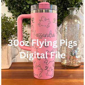 May include: A pink 30oz tumbler with a handle and a straw. The tumbler has a design of flying pigs and the name "Kassandra" on it. The text "30oz Flying Pigs Digital File" is written below the tumbler.