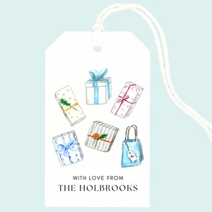 May include: A white gift tag with watercolor illustrations of wrapped presents in various colors and patterns. The tag includes the text "WITH LOVE FROM THE HOLBROOKS" and a white string for hanging.