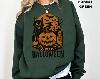 May include: Forest green sweatshirt with a Halloween graphic. The design features a black cat, carved pumpkin, bats, and a bottle with a skull label. The text "LONG LIVE HALLOWEEN" is printed below the graphic.