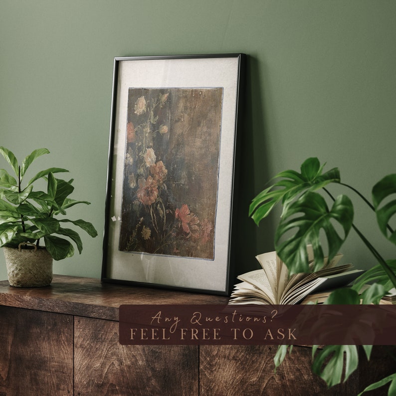 May include: A framed painting of a floral still life with a dark background and a variety of flowers in shades of pink, red, and white. The painting is hanging on a green wall above a wooden shelf with a book and two potted plants.