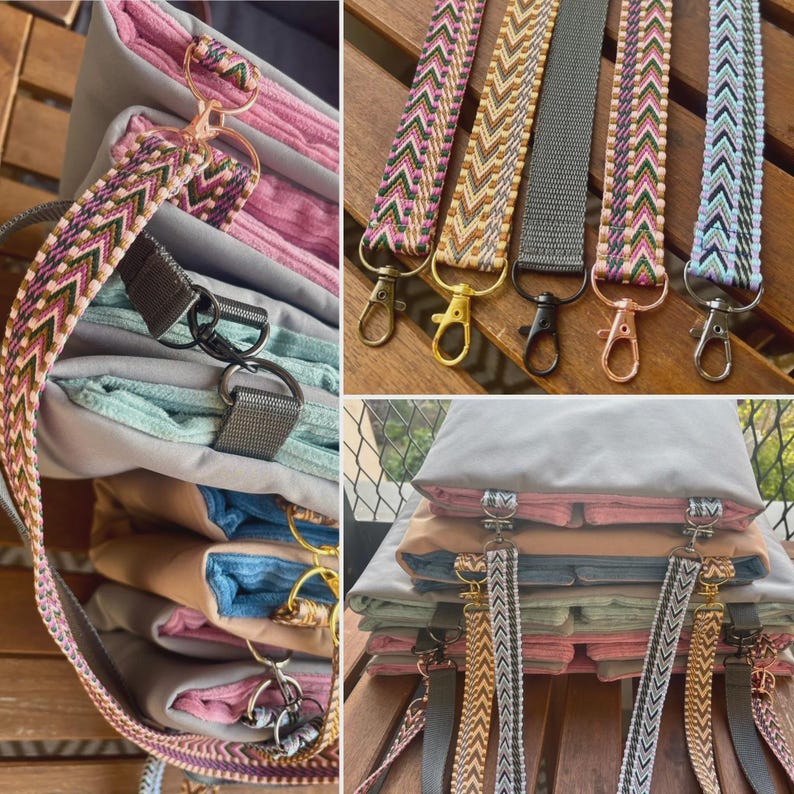 May include: A collection of colorful purse straps with various patterns and metal clasps. The straps are in shades of pink, green, gray, and gold. The image also shows a stack of folded fabric items.