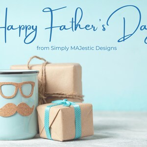 May include: A light blue mug with a mustache and glasses design, next to wrapped gifts. The image has the text "Happy Father's Day" and "from Simply MAJestic Designs" in blue script on a light blue background.