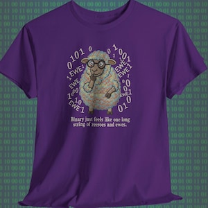 May include: A purple t-shirt with a cartoon sheep wearing glasses, surrounded by binary code and the word "EWE". The text below says "Binary just feels like one long string of zeroes and ewes."