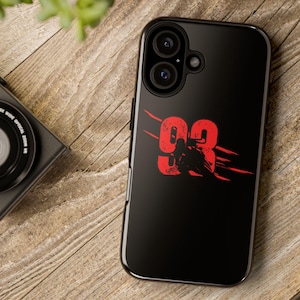 May include: Black phone case with a red number "93" printed on it. The case has a camera cutout and a black background.