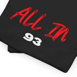 May include: Black t-shirt with red text that says "ALL IN 93".