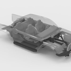 May include: A grayscale illustration of a vehicle's chassis, showcasing the interior and exterior structure. The design includes seats, a dashboard, and the vehicle's frame. The word "TACO" is visible on the front.