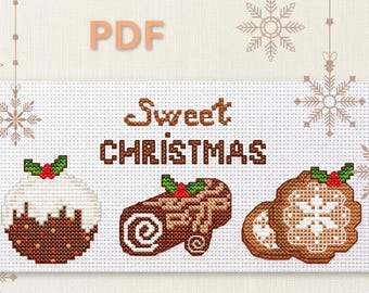 May include: A cross-stitch design with the words "Sweet CHRISTMAS" above images of a Christmas pudding, a Yule log, and two snowflake cookies. The design is in shades of brown, white, and green, with a PDF label in the top left corner.