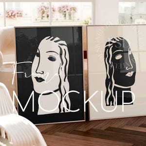 Puede incluir: Dos impresiones enmarcadas en blanco y negro de rostros femeninos estilizados. Las impresiones están en marcos dorados y están colgadas en una pared.