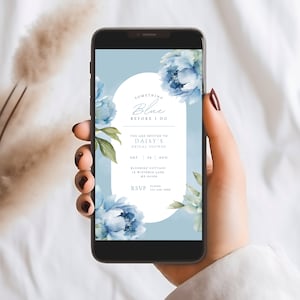 May include: A blue and white bridal shower invitation with a watercolour floral design. The text reads "Something Blue Before I Do", "You are invited to Daisy's Bridal Shower", "Sat 24 Aug", "Bluebird Cottage 14 Wisteria Lane ME 04109", "RSVP Eloise 123-456-7890".