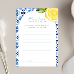 May include: A white card with blue and white tile border and a lemon illustration. The card has the text "Memories with the Bride" and "Write down a favorite memory you have with the bride".