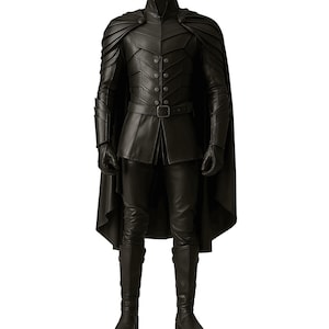 May include: A full-body shot of a black leather costume. The outfit includes a high-collared jacket with button details, a cape, gloves, pants, and knee-high boots. The costume has a fitted silhouette and a belt at the waist.