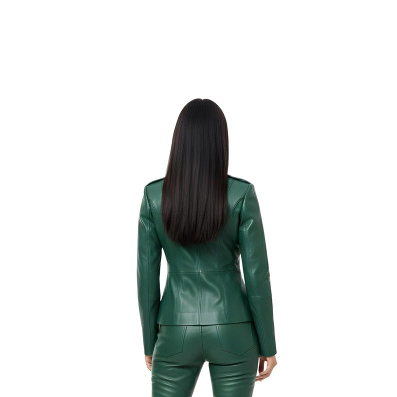 May include: A green leather jacket and matching pants set. The jacket has a tailored fit with a structured collar and button details. The pants are fitted. The model is facing away from the camera, with long black hair.