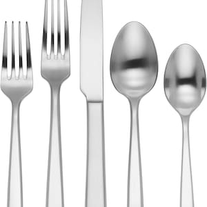 May include: A set of five silver-toned flatware pieces, including a knife, fork, and two spoons. The pieces have a modern, minimalist design with squared handles.