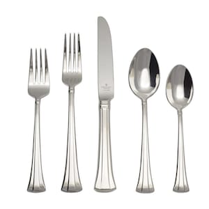 May include: A set of five silver-plated flatware pieces, including a knife, fork, and two spoons. The flatware has a simple, elegant design with a fluted handle.