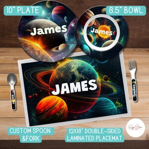 May include: A personalized space-themed children's dinnerware set with a 10-inch plate, 8.5-inch bowl, spoon, and fork. The set features a colorful galaxy design with planets and stars, and the name "James" is printed on each piece. The set also includes a 12x18-inch double-sided laminated placemat with the same design.
