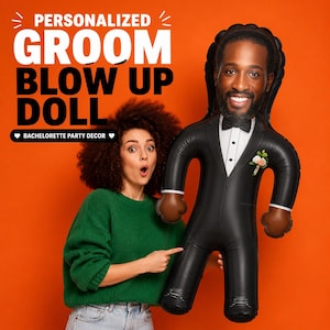 May include: A personalized groom blow up doll featuring a printed face with a beard, wearing a black tuxedo with a white shirt, black bowtie, and a floral boutonniere. The text on the orange background reads PERSONALIZED GROOM BLOW UP DOLL.