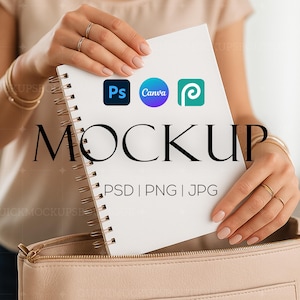 May include: A white notebook with a spiral binding, featuring the logos of Photoshop, Canva, and a design platform. The notebook is held by a hand and the text "MOCKUP PSD | PNG | JPG" is printed on the notebook.