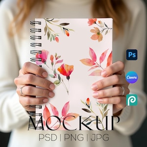 May include: A spiral-bound notebook with a floral design featuring watercolor flowers in shades of pink, orange, and red. The word "MOCKUP" is printed at the bottom, along with "PSD | PNG | JPG".