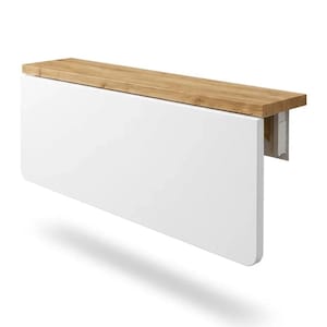 May include: A white, wall-mounted, folding table with a light brown wooden top. The table is rectangular with rounded corners and a simple, modern design. The table is designed to be space-saving.