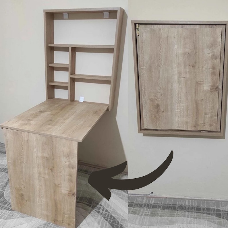 May include: A light wood folding desk with a shelf unit above it. The desk is folded down and the shelf unit is attached to the wall. The desk is shown in the folded down position and then in the unfolded position.