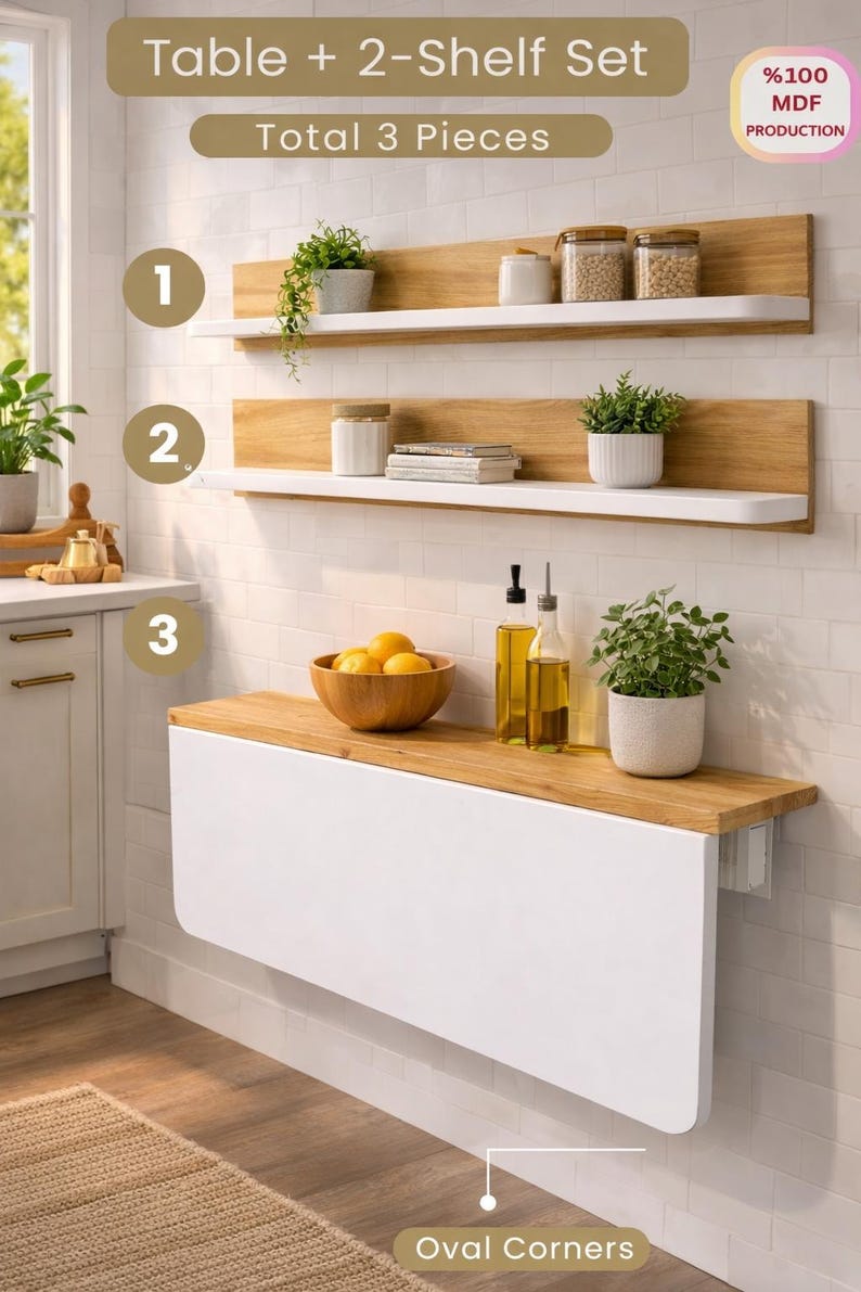 May include: A white and wood-tone table and two-shelf set. The table has a white drop-leaf design with oval corners. The shelves are wood-toned with white ledges. The set includes three pieces, perfect for a kitchen or dining area.