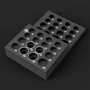 May include: Two stacked matte black rectangular storage trays featuring a grid of circular cutouts. Each tray has white printed numbers from 9 to 24, with four central holes highlighted by white circular outlines and a small circular logo in the corner.